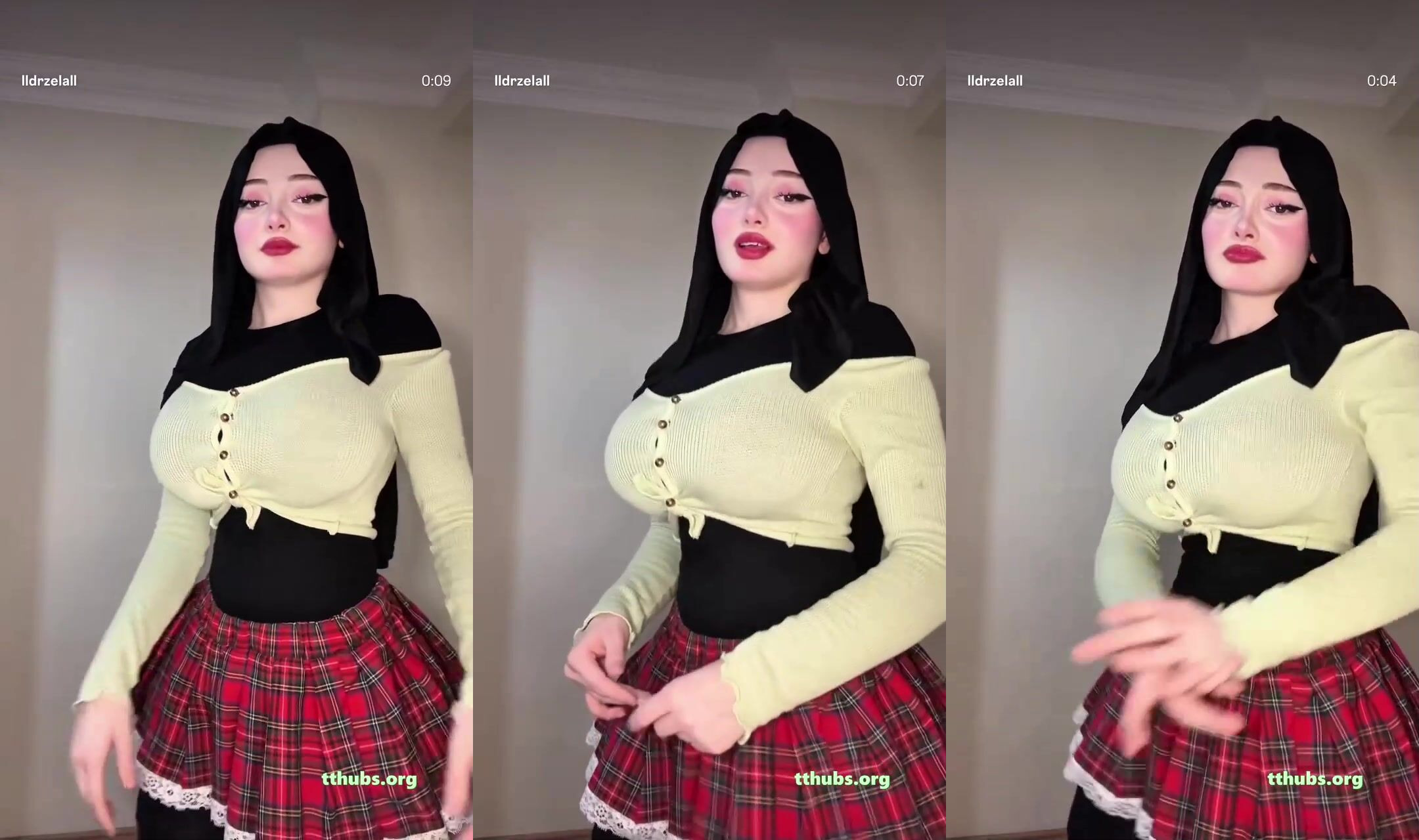 Dans eden siyah saçlı kadın krem bluz ve kırmızı ekose etekte